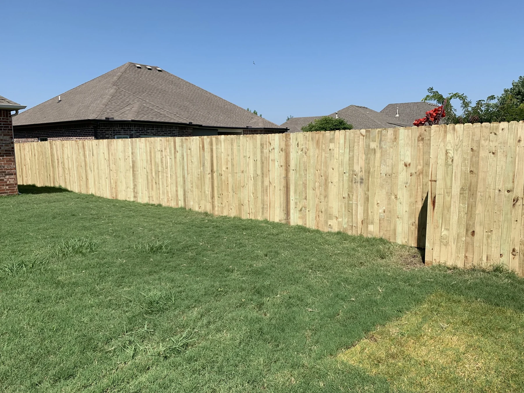 Wood privacy fencing around a residential backyard